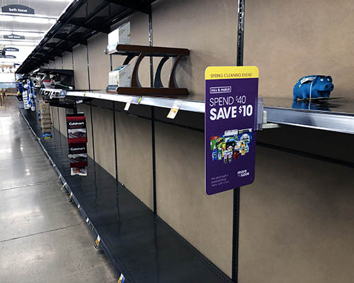 Empty grocery store shelves. 